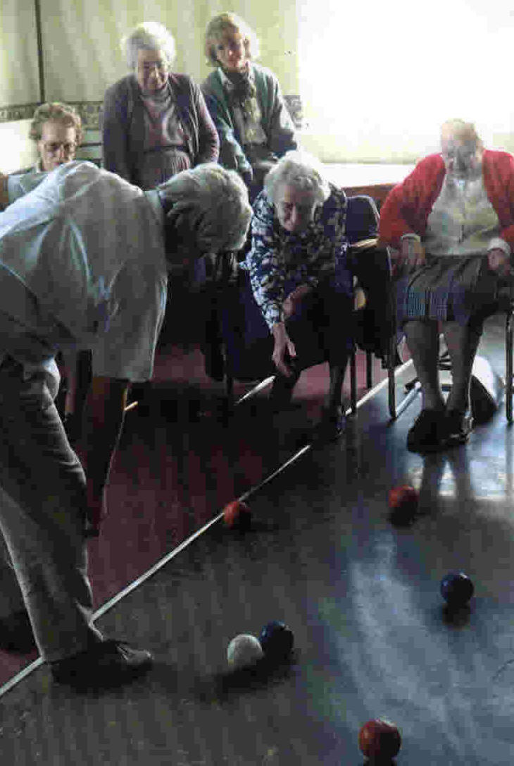 Clients Enjoy A Game of Bowls At A Day Centre